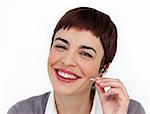 Attractive customer service representative using headset against a white background