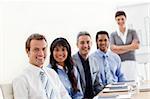 A business group showing ethnic diversity at a presentation in the office