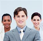 Smiling young business people standing with folded arms