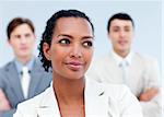 Charming young business people standing with folded arms