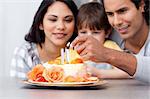 Happy family celebrating a birthday together at home