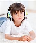 Relaxed boy listenning music in a bedroom