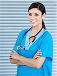 Self-assured female doctor looking at the camera in the hospital