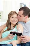 Loving couple drinking red wine