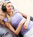 Sleeping woman using headphones on a sofa