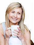 Attractive woman holding a cup of coffee against a white background