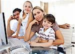 Attentive parents and their children using a computer at home