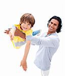 Cheerful father having fun with his son against a white background