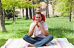 Father and his son having fun at a picnic in a park