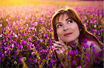 Beautiful young woman portrait on a flowery meadow