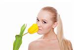pretty woman with yellow tulip isolated on white