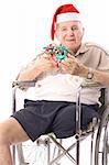 eldery man in wheelchair celebrating christmas vertical