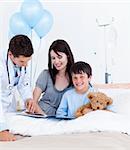 Mother and her son in a hospital with a doctor