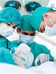 Close-up of surgeons in operative room. Medical concept