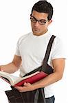University or college male student reading or studying a text book.   White background.