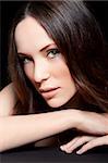 young brunette woman with green eyes beauty shot studio