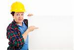 Female construction worker points at blank white space, ready for text.  Isolated on white.