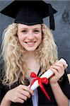 Portrait of a smiling teenage Girl Celebrating Graduation in the class