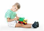 Boy holding car  isolated on white background