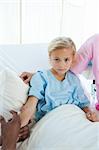 Upset child patient receiving an injection in a hospital