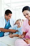 Smiling blond girl at a checkup in a hospital