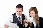 Confident couple of business people having breakfast in the kitchen