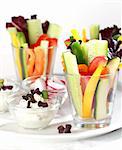 Vegetable sticks with curd cheese served in glass for catering