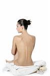 Nude sit woman back with white towel studio shot