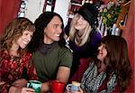 Couple with female friends at a bistro