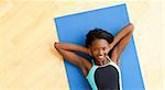 Smiling woman doing fitness in gym