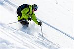 Freeride skiing. Offpiste downhill in powder snow