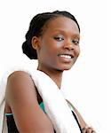 Portrait of a young afro-american woman after workout smiling at the camera against white background