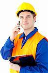 Charismatic worker talking on phone holding a clipboard against white background
