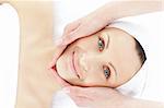 Attractive woman enjoying a head massage in a spa center