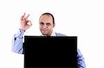 Young businessman holding a blackboard displaying the sign of success, isolated on white, studio shot