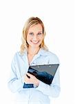 Assertive businesswoman taking notes on a clipboard against a white background