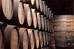 Old wine cellar full of wooden barrels