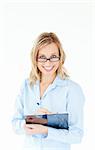 Smiling businesswoman wearing glasses and holding a clipboard against a white background