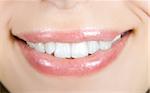 Smiling woman mouth with white teeth closeup