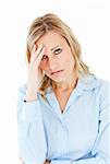 Caucasian businesswoman with a headache looking at the camera against white background