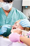 A dentist working on a tooth at a dental clinic