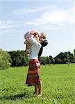 mother and daughter having fun on meadow