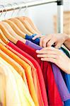 Close-up of a female hispanic customer looking for clothes in a fashion store