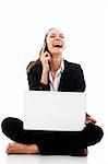 young businesswoman with laptop on the floor on white background studio