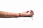 A bloody knife and a cut wrist, isolated on white and LOVE cut across the arm. This image has numerous uses like accidents, domestic violence, suicide, murder, hate, etc...