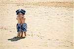 Twin Boys Hugging on Beach