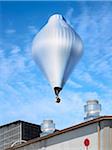 Hot Air Balloon over Factories, Oakland, California, USA