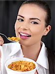 Portrait of beautiful woman, she eating cornflakes