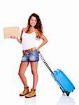 Beautiful young woman carrying a blue suitcase and holding a cardboard, isolated on white background