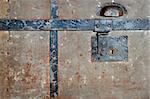 Close up of rusty lock on vintage metal chest